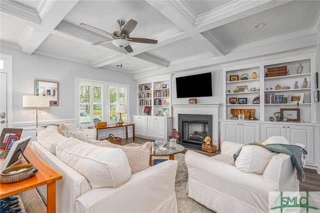 living room featuring crown molding, ceiling fan, beam ceiling, and coffered ceiling