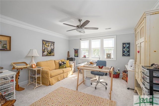 home office featuring ceiling fan, light colored carpet, baseboards, visible vents, and ornamental molding
