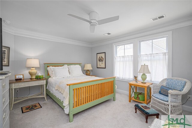 carpeted bedroom with crown molding, baseboards, a ceiling fan, and visible vents