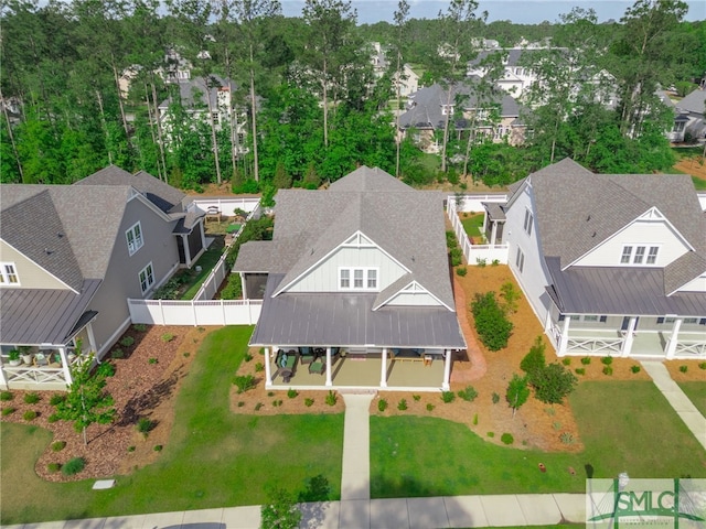 birds eye view of property with a residential view
