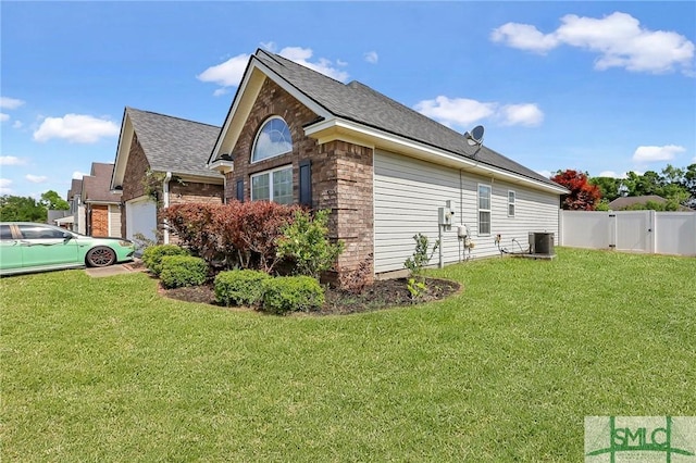 1212 Peacock Trl, Hinesville, GA 31313 - view of property exterior with a yard, fence, cooling unit, and a shingled roof