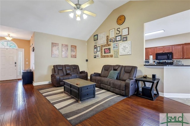 1212 Peacock Trl, Hinesville, GA 31313 - living room with baseboards, a ceiling fan, dark wood-style floors, and lofted ceiling