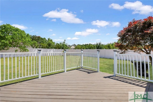 1212 Peacock Trl, Hinesville, GA 31313 - wooden deck with a lawn and a fenced backyard
