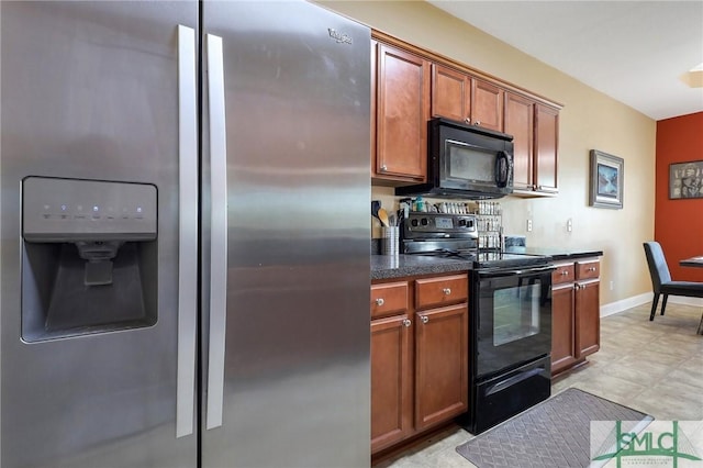 1212 Peacock Trl, Hinesville, GA 31313 - kitchen featuring brown cabinetry, baseboards, and black appliances