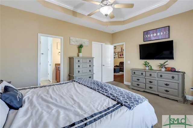 1212 Peacock Trl, Hinesville, GA 31313 - carpeted bedroom with crown molding, connected bathroom, a raised ceiling, a ceiling fan, and baseboards