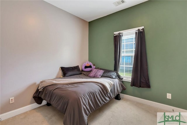 1212 Peacock Trl, Hinesville, GA 31313 - bedroom with baseboards, visible vents, and carpet