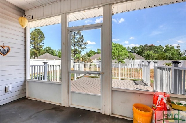 1212 Peacock Trl, Hinesville, GA 31313 - doorway to outside with wood walls and unfinished concrete flooring