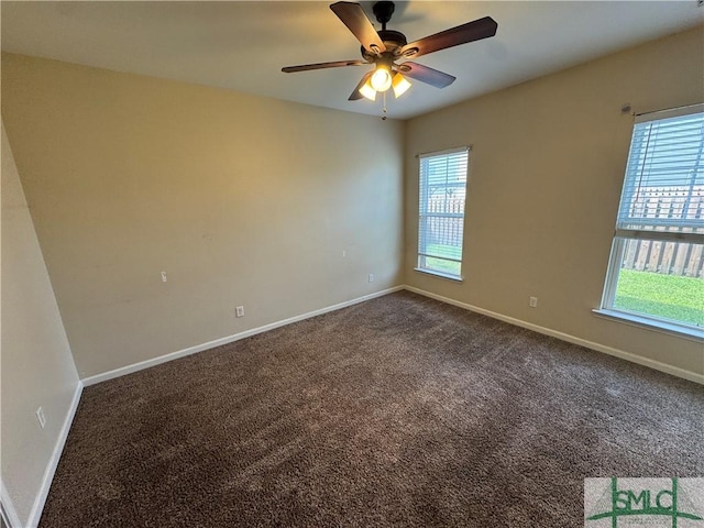 empty room with carpet floors, baseboards, and ceiling fan