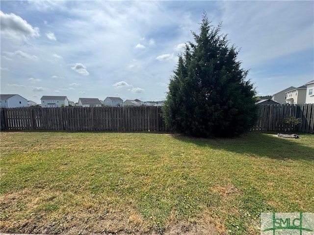 view of yard featuring a fenced backyard