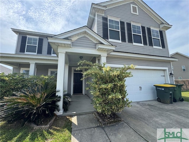 view of front of property with driveway and a garage