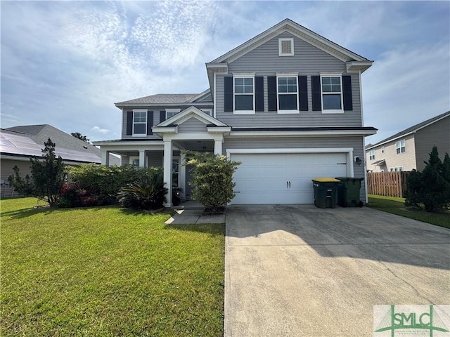 traditional home featuring a garage, a front lawn, fence, and driveway