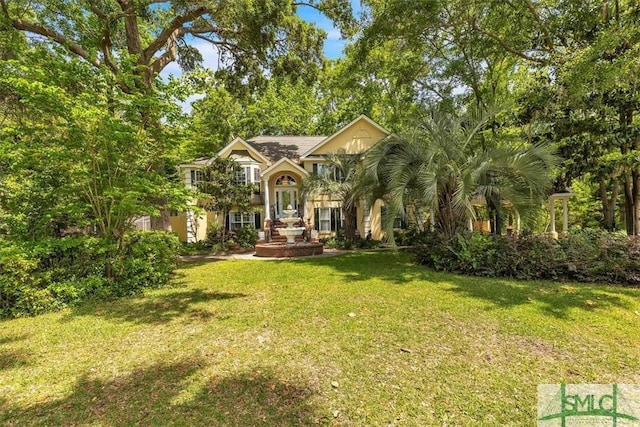view of front of home with a front yard