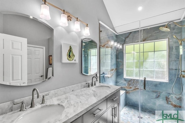 full bath featuring a sink, a stall shower, and a wealth of natural light