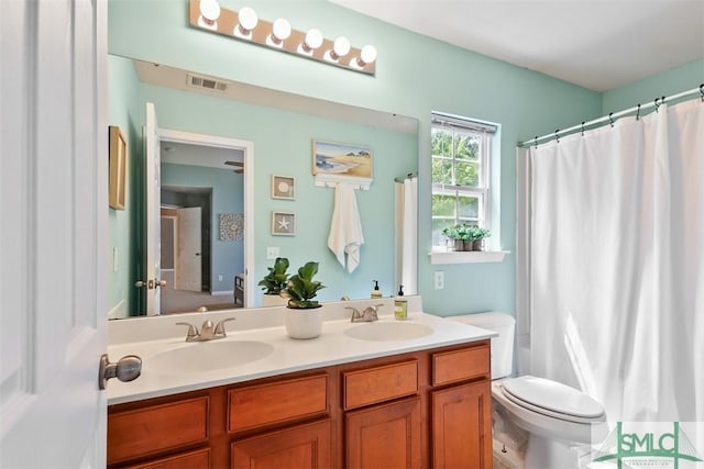 76 Hamilton Grove Dr, Pooler, GA 31322 - bathroom featuring a sink, toilet, double vanity, and visible vents
