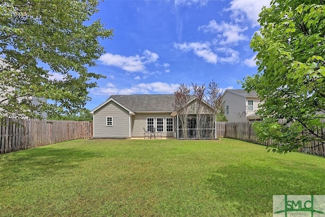 76 Hamilton Grove Dr, Pooler, GA 31322 - back of house featuring a lawn, a fenced backyard, and a sunroom