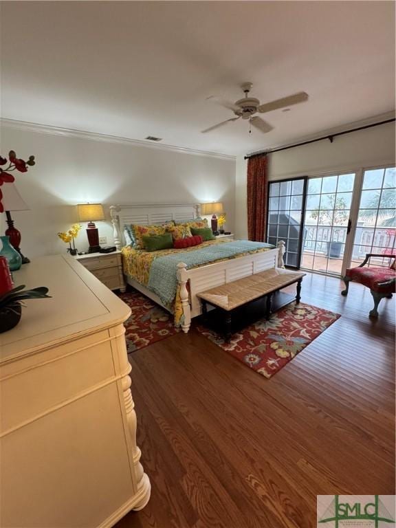 bedroom with dark wood finished floors, ceiling fan, visible vents, access to outside, and crown molding