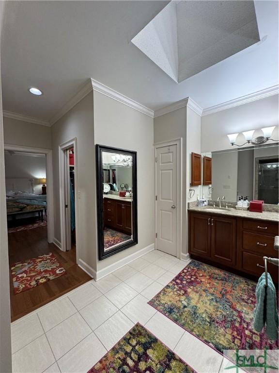 full bath featuring recessed lighting, baseboards, ornamental molding, tile patterned floors, and vanity