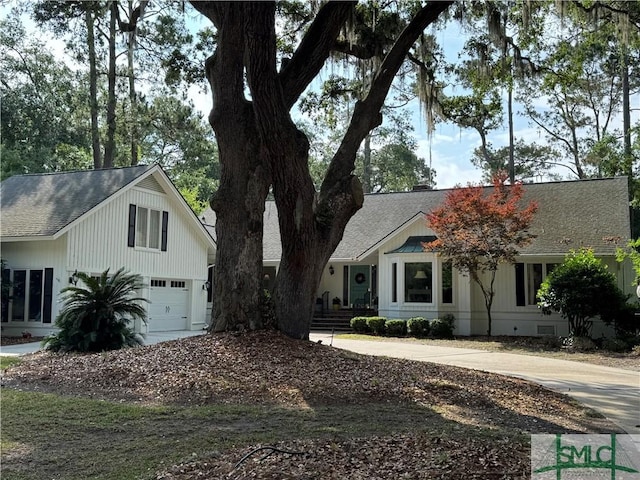 31 Sweetgum Xing, Savannah, GA 31411 - view of front facade with an attached garage, roof with shingles, and driveway