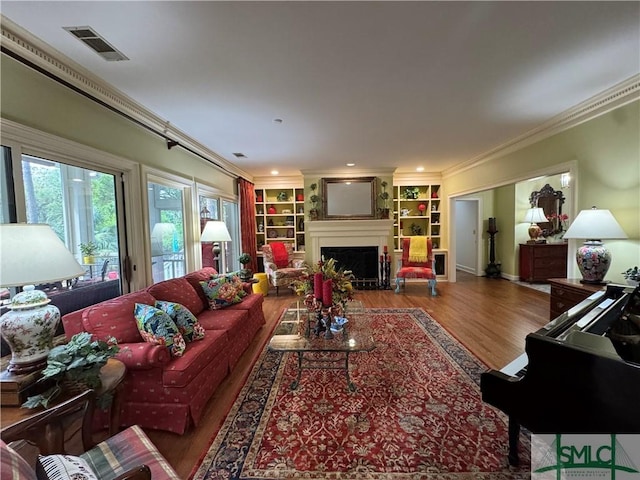 31 Sweetgum Xing, Savannah, GA 31411 - living room with crown molding, wood finished floors, a fireplace, and built in features