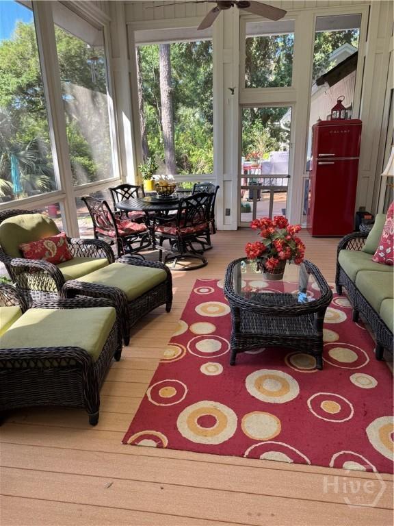 31 Sweetgum Xing, Savannah, GA 31411 - sunroom / solarium featuring a ceiling fan, an outdoor living space, and outdoor dining area