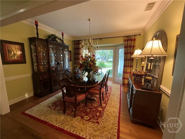 31 Sweetgum Xing, Savannah, GA 31411 - dining area with wood finished floors, a chandelier, and ornamental molding