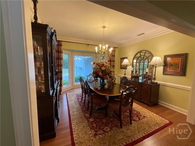 31 Sweetgum Xing, Savannah, GA 31411 - dining space with wood finished floors, a chandelier, and ornamental molding