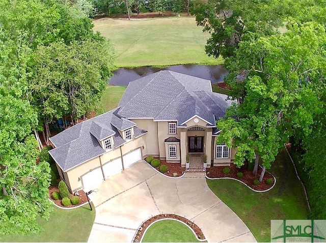 birds eye view of property featuring a water view