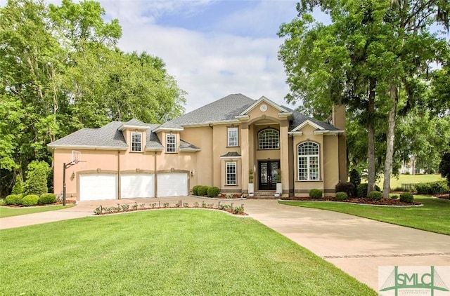 traditional home featuring a front lawn, roof with shingles, stucco siding, french doors, and concrete driveway