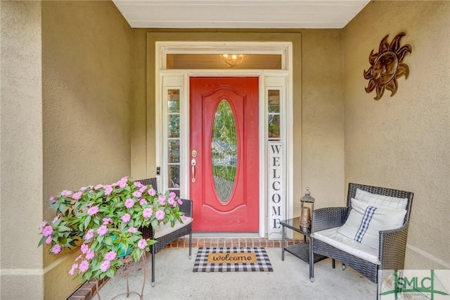 property entrance featuring stucco siding