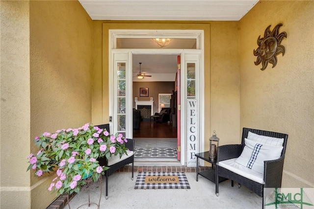 entrance to property featuring stucco siding