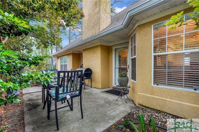 view of patio featuring outdoor dining area
