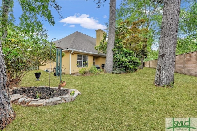 view of yard featuring fence