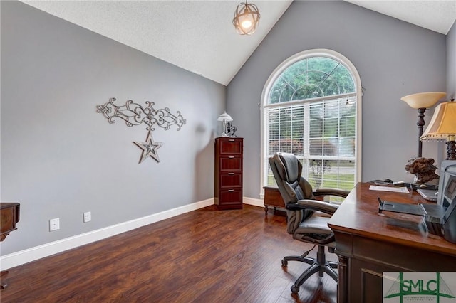 home office with baseboards, wood finished floors, and high vaulted ceiling