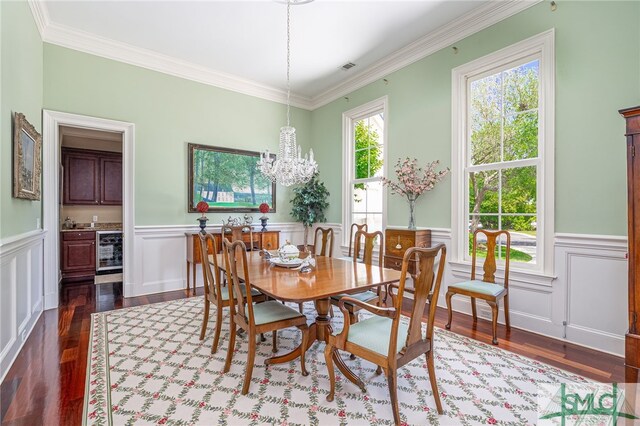 dining room with a wainscoted wall, dark wood-style floors, and beverage cooler