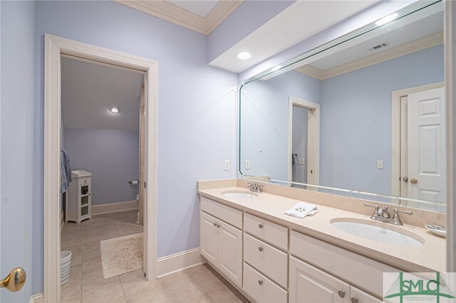 full bath with double vanity, a sink, tile patterned floors, and ornamental molding