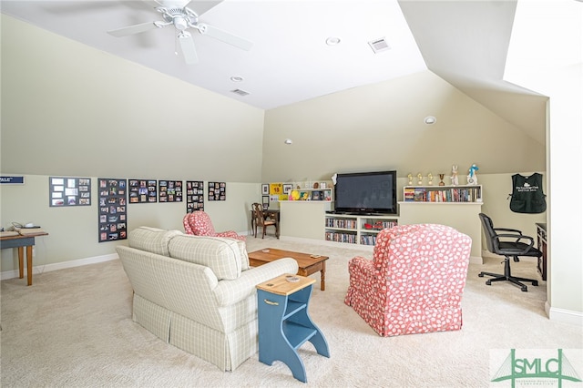 carpeted living room with a ceiling fan, baseboards, visible vents, and vaulted ceiling