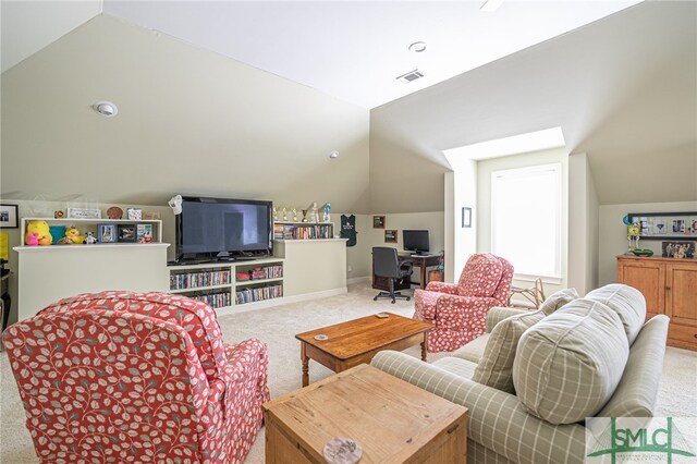 carpeted living room with visible vents and vaulted ceiling
