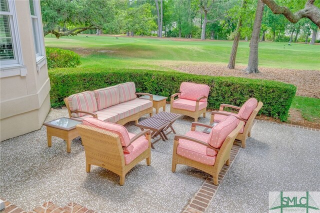 view of patio / terrace with an outdoor living space and golf course view