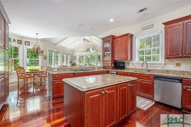 kitchen with dark wood-style flooring, tasteful backsplash, stainless steel dishwasher, a sink, and a peninsula