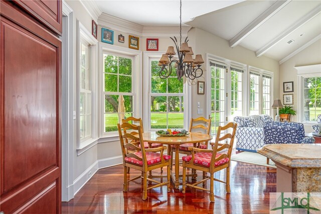 sunroom featuring beamed ceiling, a chandelier, and visible vents