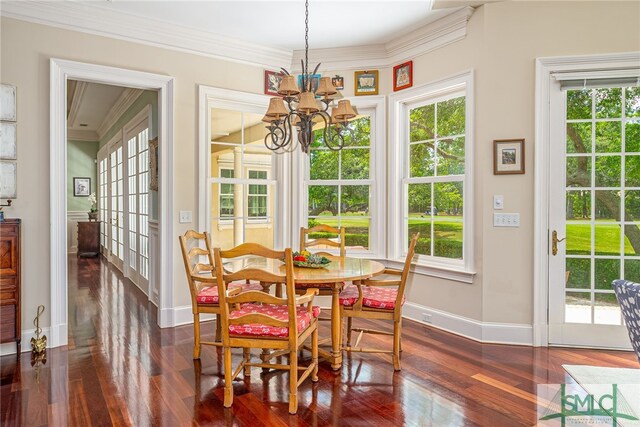 dining area featuring baseboards, a chandelier, and dark wood-type flooring