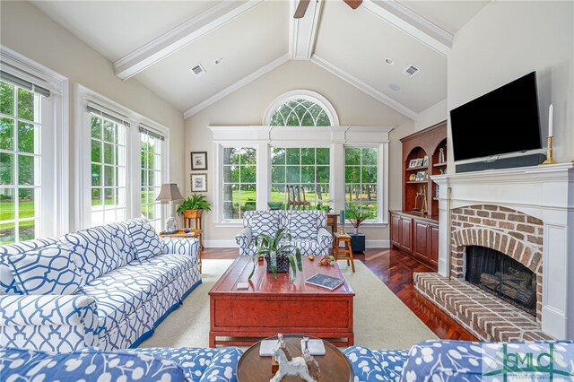 living room with ceiling fan, visible vents, a fireplace, wood finished floors, and lofted ceiling with beams