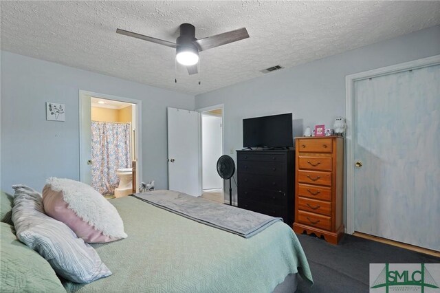 121 Pelican Ln, Richmond Hill, GA 31324 - bedroom with a ceiling fan, a textured ceiling, visible vents, ensuite bathroom, and carpet flooring