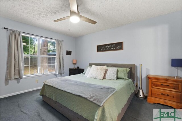 121 Pelican Ln, Richmond Hill, GA 31324 - carpeted bedroom featuring baseboards, a ceiling fan, and a textured ceiling
