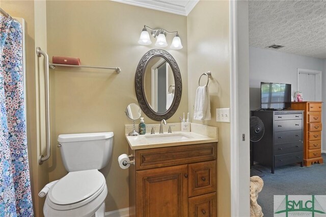 121 Pelican Ln, Richmond Hill, GA 31324 - bathroom with vanity, toilet, a shower with shower curtain, visible vents, and ornamental molding