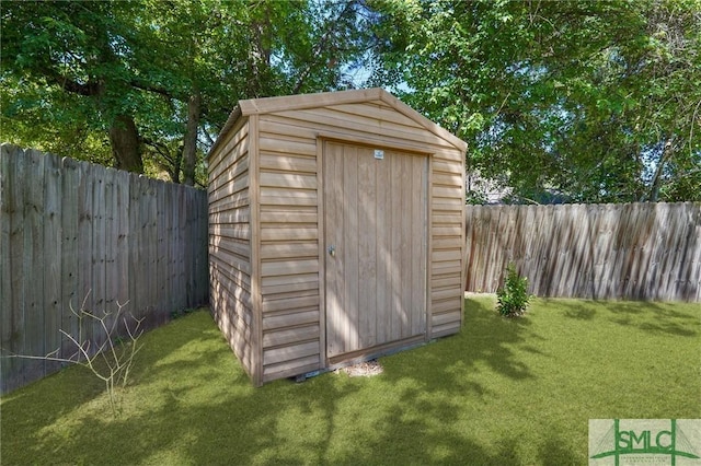 121 Pelican Ln, Richmond Hill, GA 31324 - view of shed with a fenced backyard