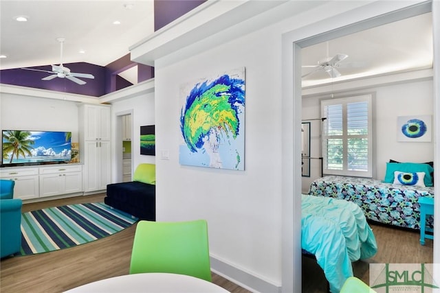 interior space with recessed lighting, ceiling fan, wood finished floors, and vaulted ceiling
