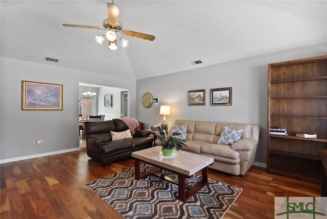 living area featuring visible vents, wood finished floors, and lofted ceiling