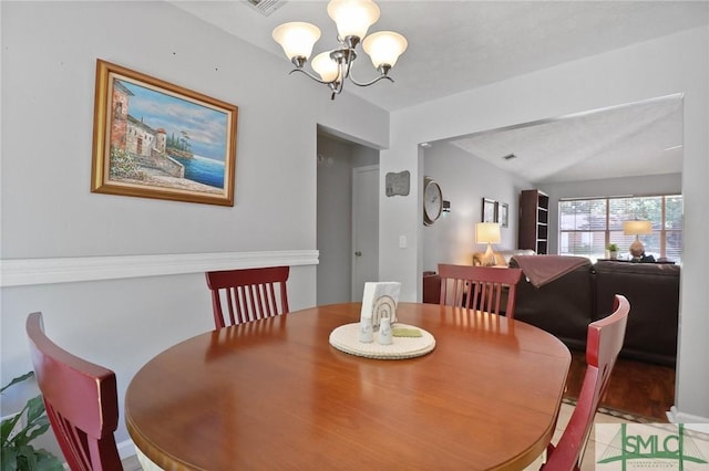 dining space with an inviting chandelier