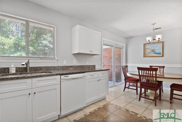 kitchen with white cabinets, hanging light fixtures, an inviting chandelier, a sink, and dishwasher